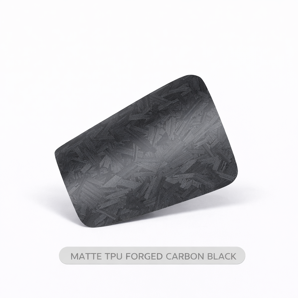 Black textured rectangular object on a white background